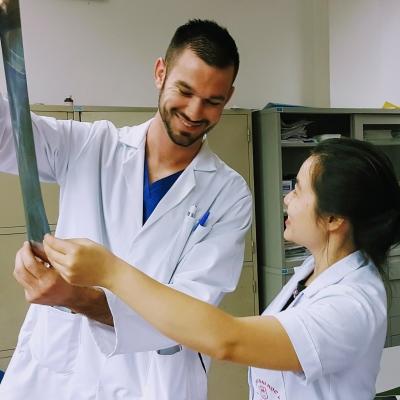 A local doctor explains what can been seen on an x-ray to a Projects Abroad medical intern during his placement in Vietnam. A Projects Abroad Medicine intern listens as a doctor explains the results of an x-ray at a hospital in Vietnam.